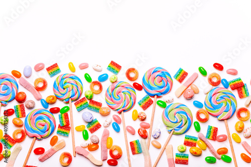 Mixed collection of colorful candy, on white background. Flat lay, top view