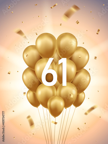 61st Year anniversary celebration background. Golden balloons and confetti with sunbeams in background. photo