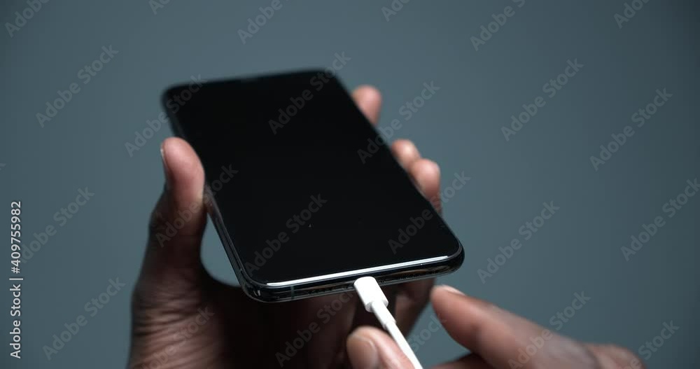 Phone 11 pro is charged with a charging cable
