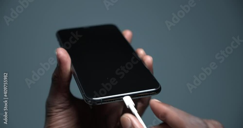 Phone 11 pro is charged with a charging cable
