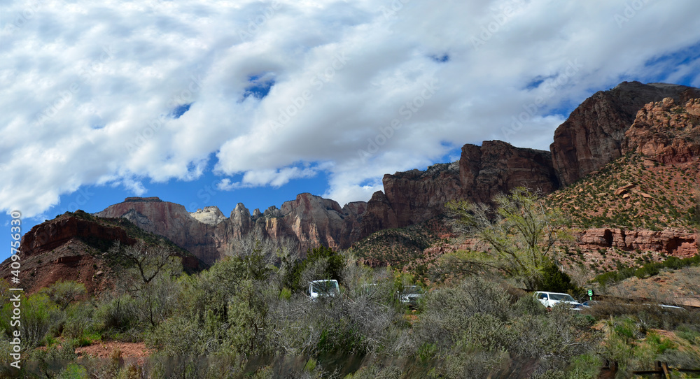 Cars parked in Zion National Park Utah, with the three kings cliffs in background. Cars parked in Zion National Park Utah, with the three kings cliffs in background.