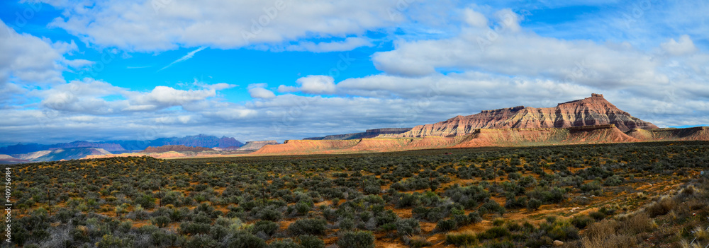 Panoramic View of Utah arid desert landscape, with pink Mesa.