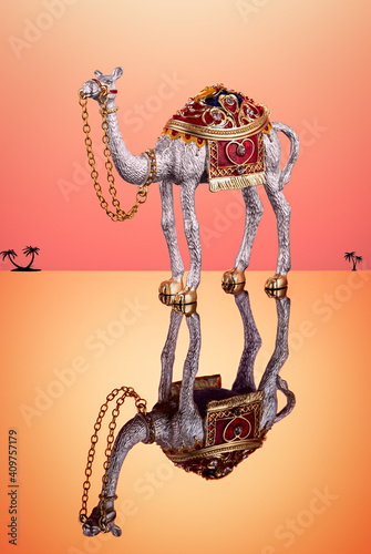 Camel made of metal with decorative saddle and decorative stones