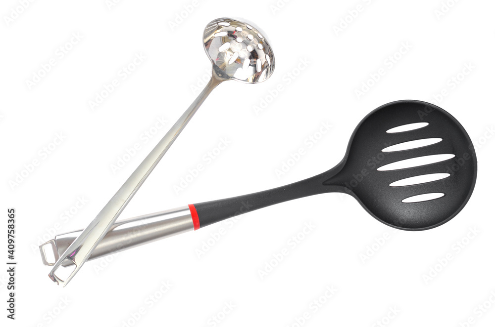 Kitchen utensils spoon with slots, slotted spoon isolated on white background. Studio Photo Kitchen utensils spoon with slots, slotted spoon isolated on white background. Studio Photo