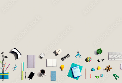 Collection of electronic gadgets and office supplies - flat lay