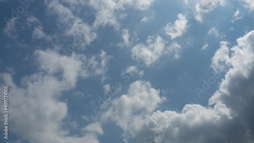 Cloudscape in blue sunny day. Fast move of White clouds transformed to gray in a summer midday. Heavenly sky in a hot spring day. Cumulus fluffy heavenly skycaps nature background. photo