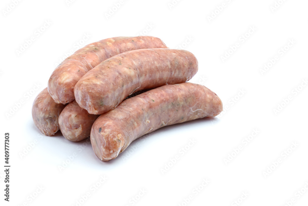Raw pork sausages.Grilled sausages in close-up, isolated on a white background.Selective focus. Raw pork sausages.Grilled sausages in close-up, isolated on a white background.Selective focus.