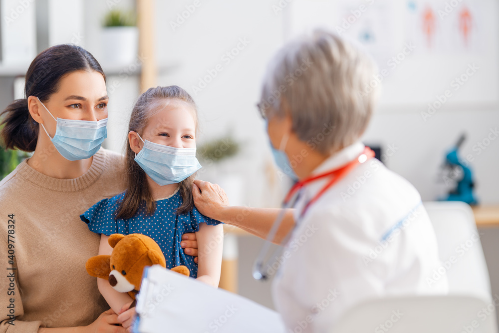 Doctor, child and mother wearing facemasks Doctor, child and mother wearing facemasks