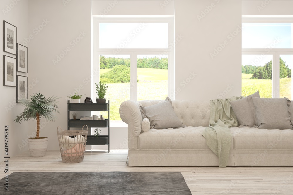 Fototapeta premium White living room with sofa and summer landscape in window. Scandinavian interior design. 3D illustration