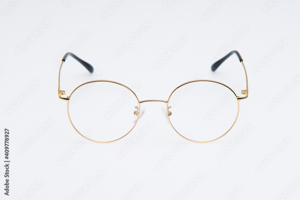 Fototapeta premium Fashion sunglasses golden frames on white background.