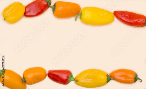 Wallpaper Mural  fresh small multicolored bell peppers isolated on light background. Red, yellow and orange peppers Torontodigital.ca