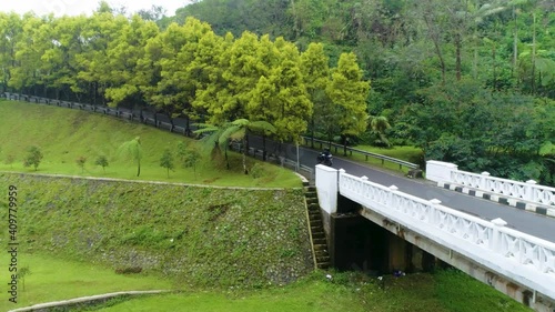 Wallpaper Mural Drone over Jakarta Indonesia, donwtown skyscrapers, beautiful countryside with forest, jungle, farming and mountains, city streets, country roads, motorcycles, and people marching. Torontodigital.ca