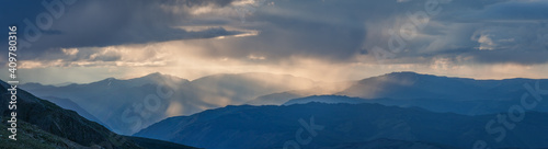 Fototapeta Naklejka Na Ścianę i Meble -  Rainy weather in the mountains, evening light. Panoramic view.