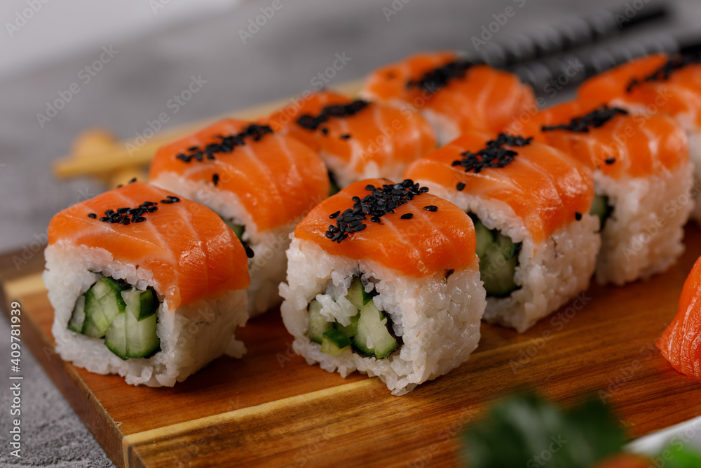 Philadelphia roll with cucumber and sushi with salmon and tuna. Sushi menu. Japanese food. Philadelphia roll with cucumber and sushi with salmon and tuna. Sushi menu. Japanese food.