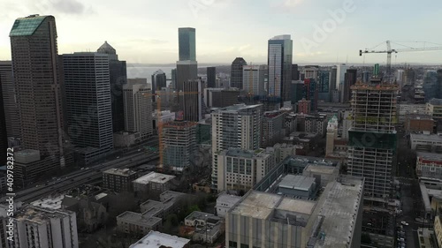 Cinematic aerial drone pan footage of Columbia Center, Smith Tower, First Hill, Yesler Terrace, skyscrapers and high-rise commercial and residential buildings downtown Seattle, Washington photo