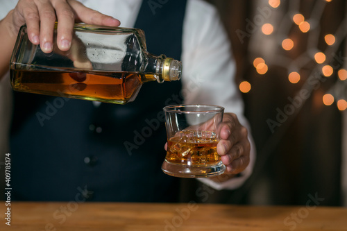 whiskey being poured into glass