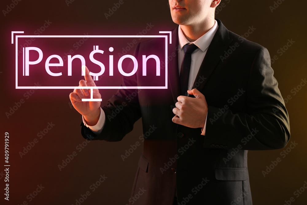Businessman with text PENSION on dark background Businessman with text PENSION on dark background