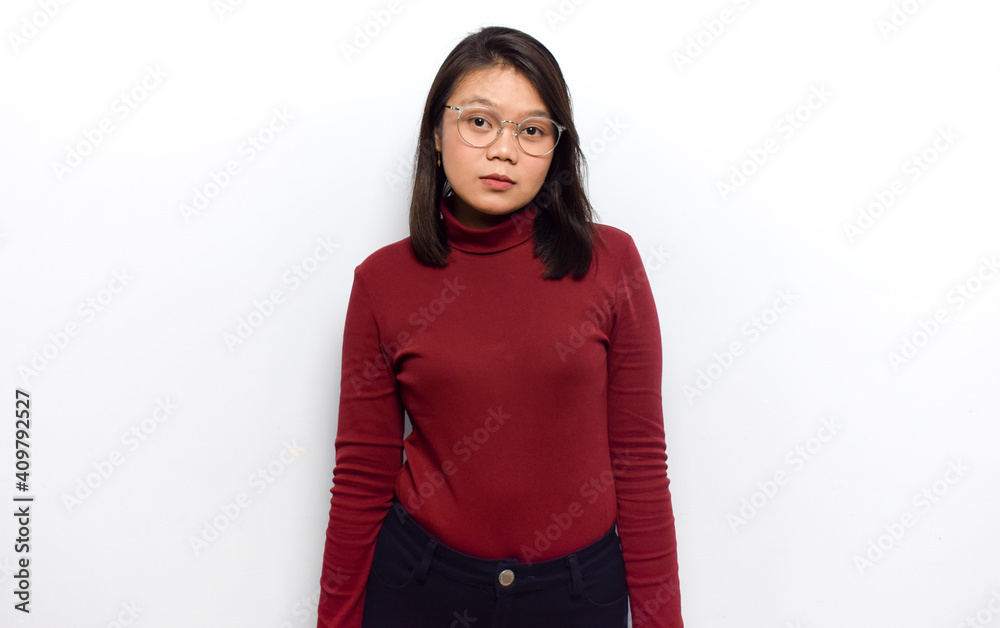 Looking at camera with sad face of Young beautiful asian women dress red shirt isolated on white background Looking at camera with sad face of Young beautiful asian women dress red shirt isolated on white background