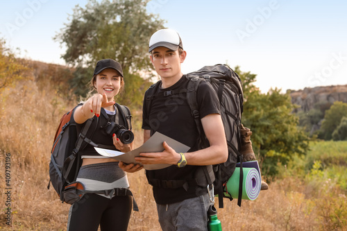 Couple of young tourists wi...
