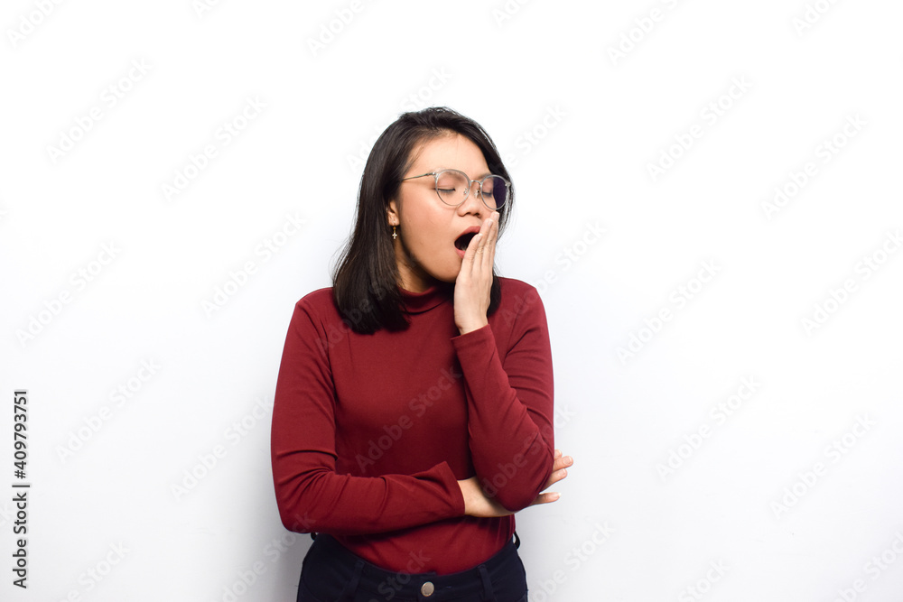 Yawn gesture expression of Young beautiful asian women dress red shirt isolated on white background Yawn gesture expression of Young beautiful asian women dress red shirt isolated on white background