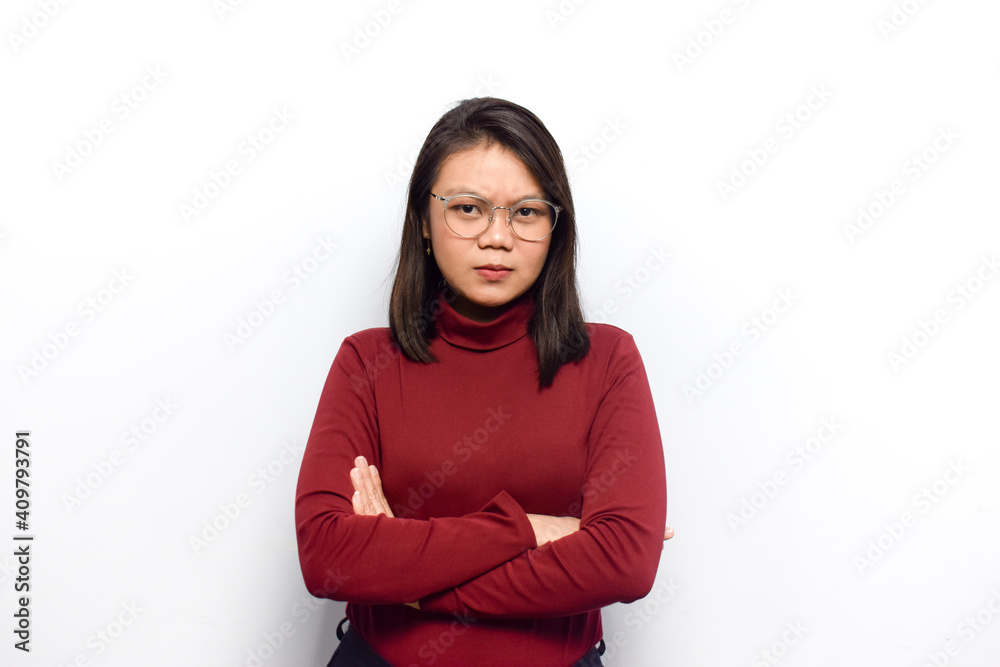 Crossed arms and look angry expression of Young beautiful asian women dress red shirt isolated on white background Crossed arms and look angry expression of Young beautiful asian women dress red shirt isolated on white background