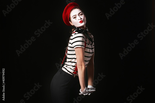 Female pantomimist on dark background