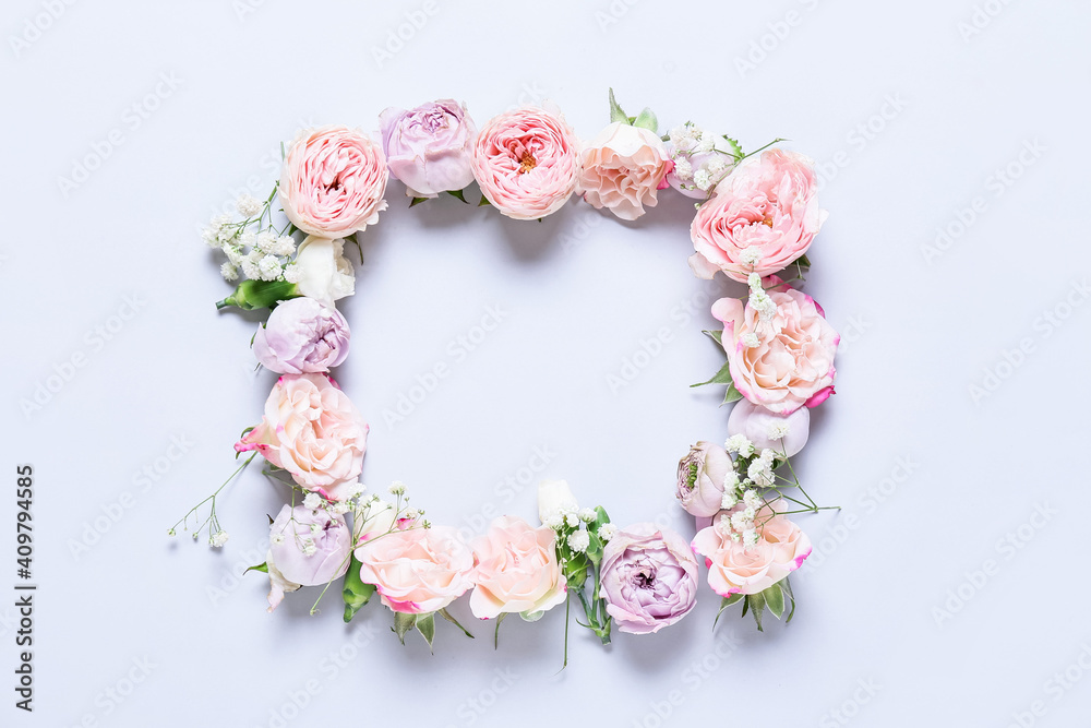 Frame made of beautiful flowers on light background Frame made of beautiful flowers on light background