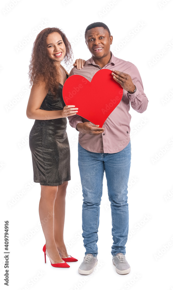 African-American couple with red heart on white background. Valentine's Day celebration African-American couple with red heart on white background. Valentine's Day celebration