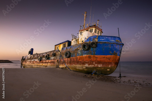 old abandoned fishing boat on a beach