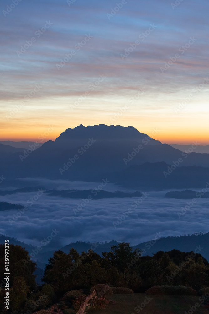 mountain and sea of fog sunrise surrounded with mountain and forest at huai nam dang national park chiang mai, thailand