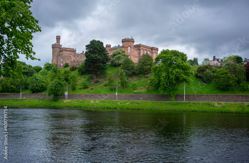 Inverness Castle is a red sandstone construction as seen from across River Ness.