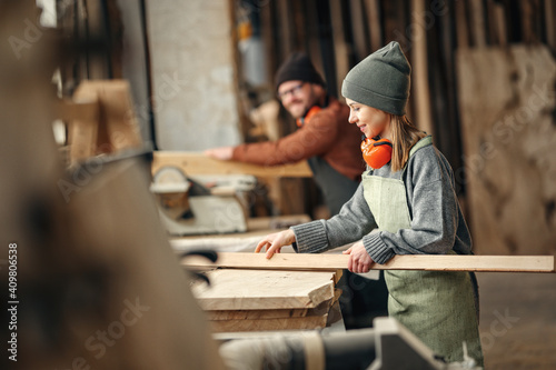 Craftswoman working with wood in workshop