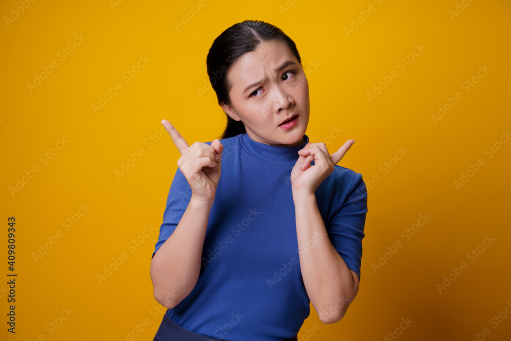 Confused Asian woman isolated on background. Confused Asian woman isolated on background.