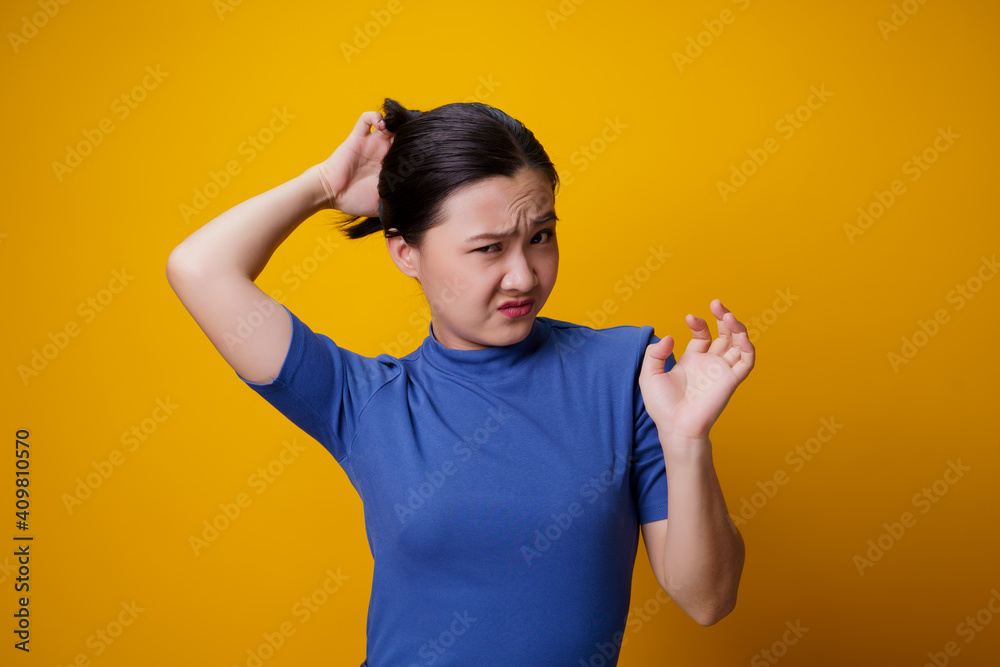 Asian woman scratching her head. Asian woman scratching her head.