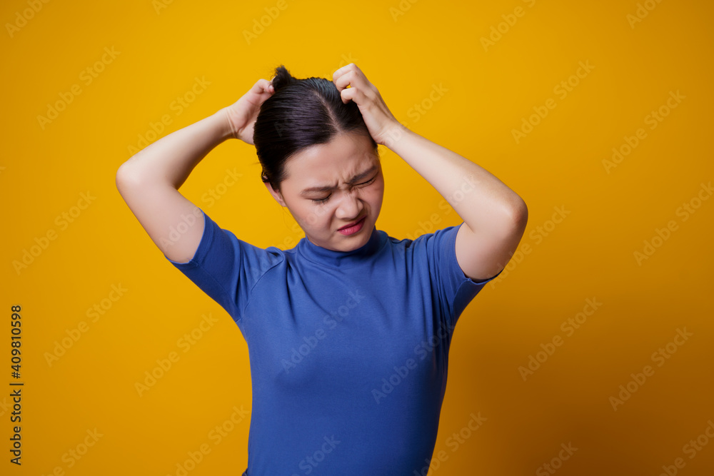 Asian woman scratching her head. Asian woman scratching her head.