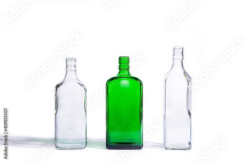 Glass bottles of different shapes isolated on white background
