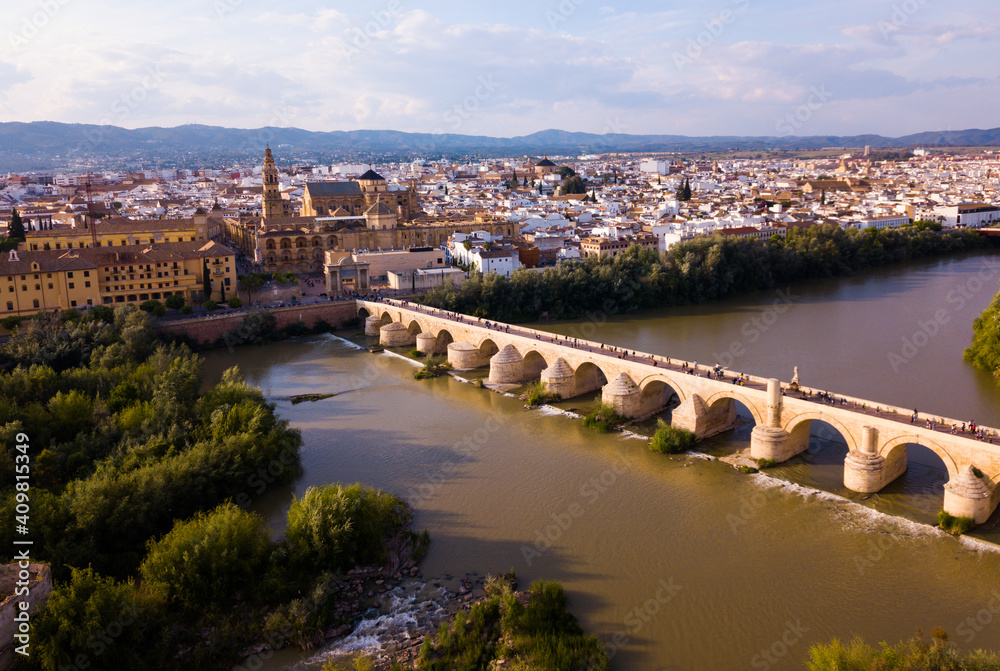 Roman Bridge over the Guadalquivir from aerial panoramic view with Mosque-Cathedral in Cordoba