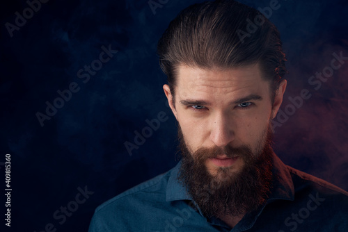 Cute bearded man in shirt elegant style close-up dark background © SHOTPRIME STUDIO