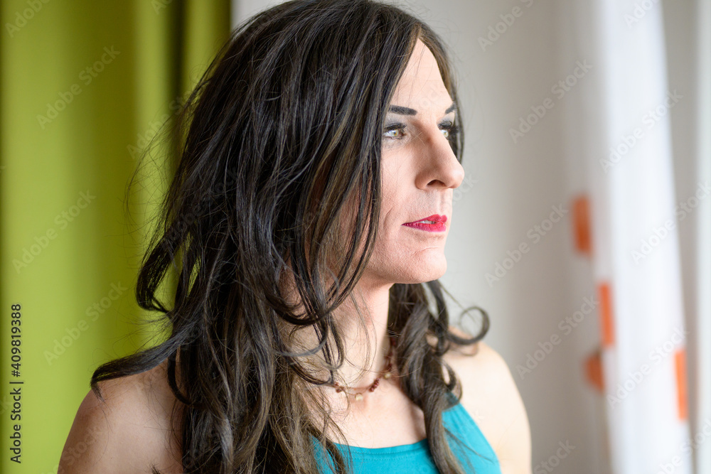Close up portrait of a thoughtful transgender woman