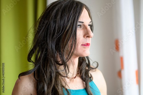 Close up portrait of a thoughtful transgender woman