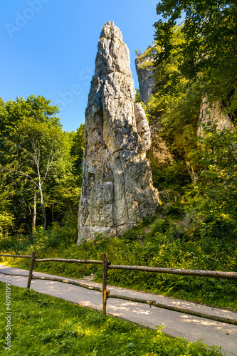 Fototapeta Naklejka Na Ścianę i Meble -  Iglica limestone rock known as Spire or Needle in Bedkowska Valley within Jura Krakowsko-Czestochowska upland near Cracow in Lesser Poland