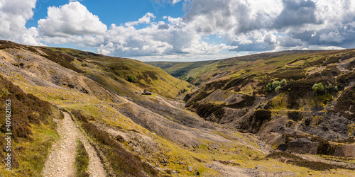 The remains of Bunton Mine with the Gunnerside Gill landscape, near Gunnerside, North Yorkshire, England, UK photo