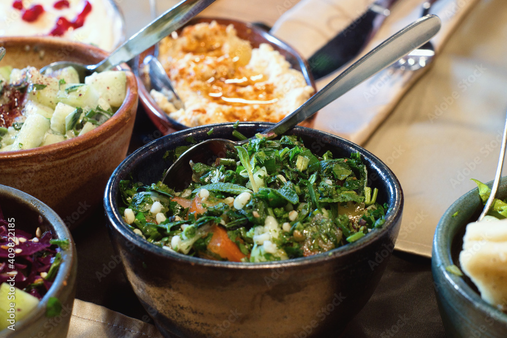 Aramic mezze platter (starters) - hummus, mutabbal, babaganosh, tabbouleh, pita Aramic mezze platter (starters) - hummus, mutabbal, babaganosh, tabbouleh, pita