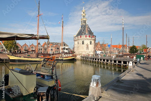 The harbor (Binnenhaven) of Hoorn, West Friesland, Netherlands, with the Hoofdtoren (The Head Tower) and old wooden sailing boats photo