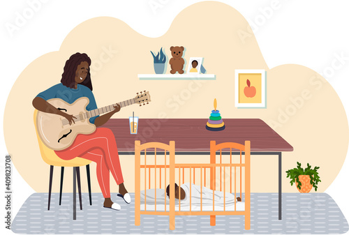 Woman playing guitar. Mom singing lullaby to baby at night and helps him to sleep. Musician creates music. Mother playing strings on instrument. Family rest together at home. Guitarist makes melody