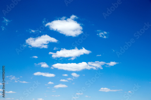Blue sky background with tiny clouds. fluffy clouds in the sky. Background summer sky