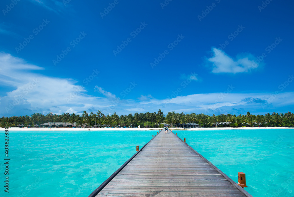 Beautiful beach with white sand.  ocean, blue sky with clouds.  Sunny day. Maldives tropical landscape