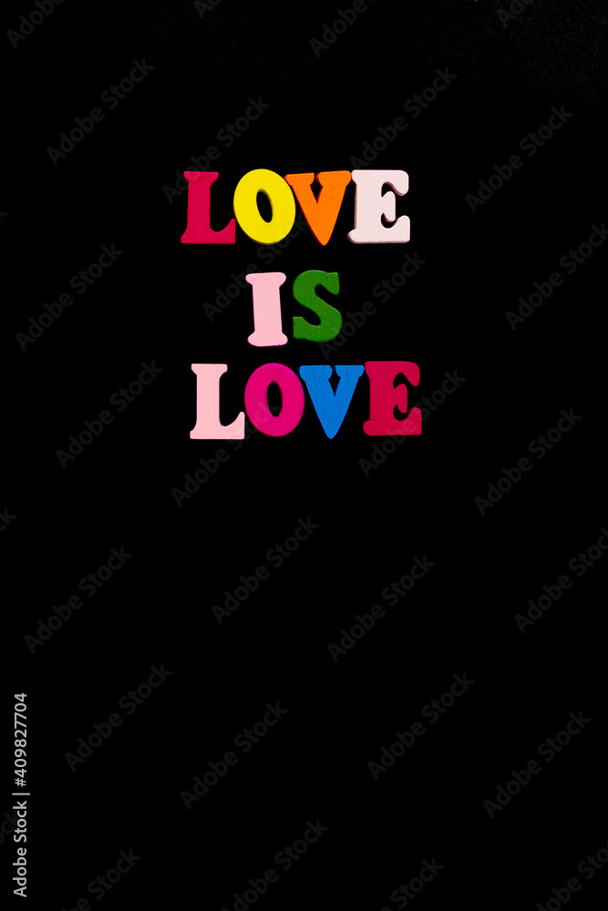 words love is love, notepad with chalk drawn heart. Valentine's day concept. words love is love, notepad with chalk drawn heart. Valentine's day concept.