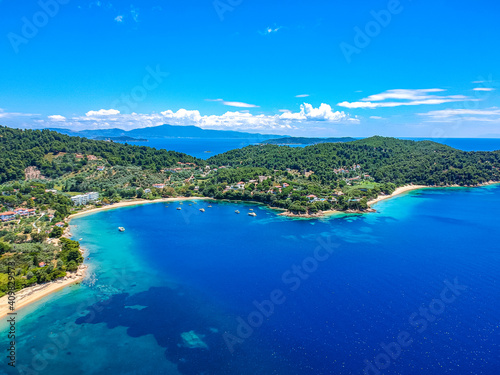 Aerial view over southern skiathos island, Greece with modern hotels and luxurious villas in Sporades, Greece, © panosk18