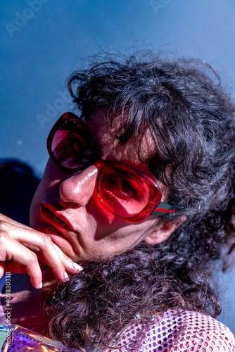 Young woman portrait wearing red sunglasses